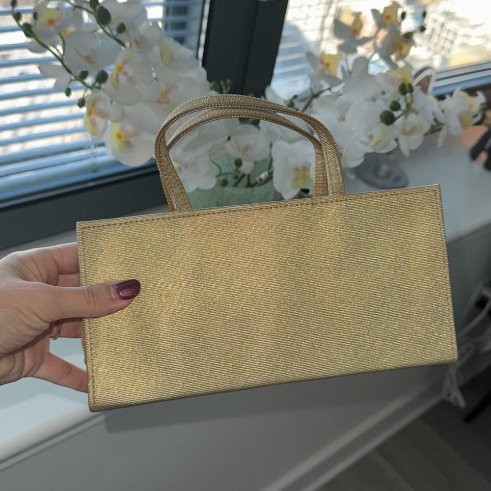 Vintage Estee Lauder gold tone clutch